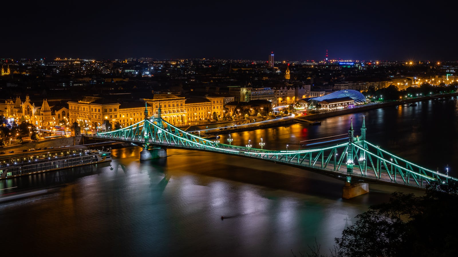 Budapest illuminated on the Danube at night